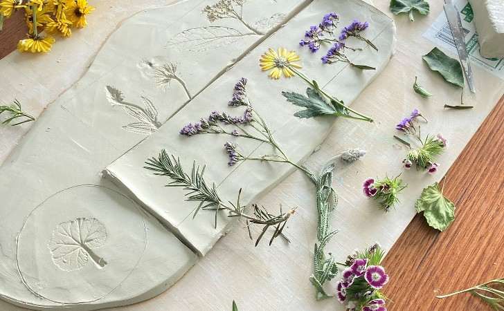 flowers pressed into clay