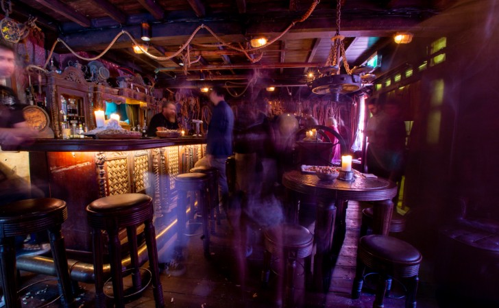 dimly lit shipwreck-themed bar