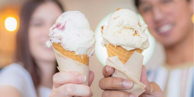 two people holding ice cream cones at Swan River Gelato in Fremantle