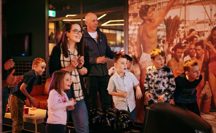 Family having fun during school holidays at Strike Bowling at FunLab, FOMO Fremantle