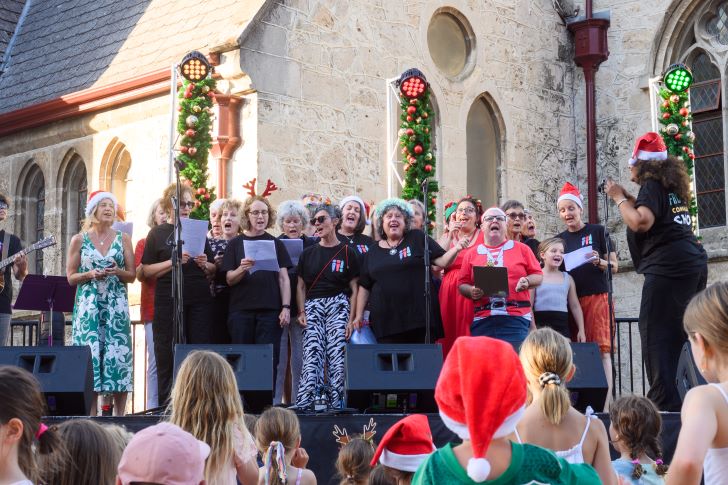 Carollers in a town square.