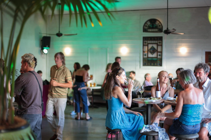 People drinking in a cool bar. 