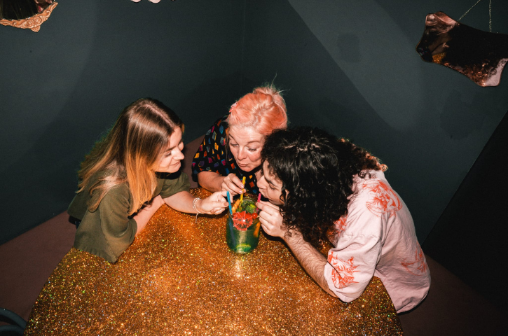 Ladies drinking cocktails in a bar. 