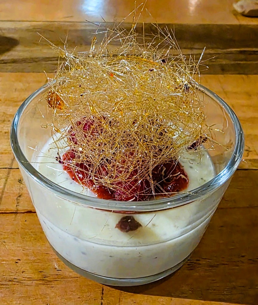 a white chocolate truffle mouse with resh raspberry and sugar crystal&nbsp; 