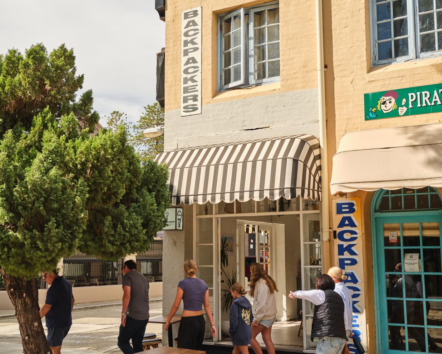 some people walking outside of a backpackers accommodation in Fremantle, WA 
