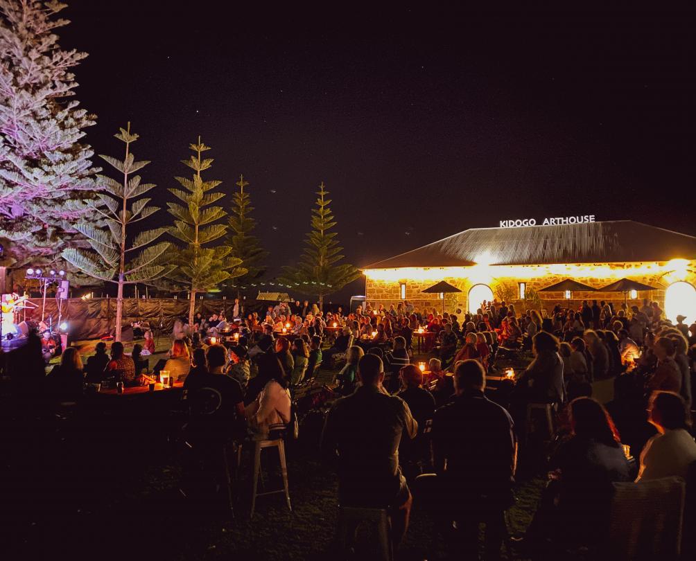 people standing in a crowd at night