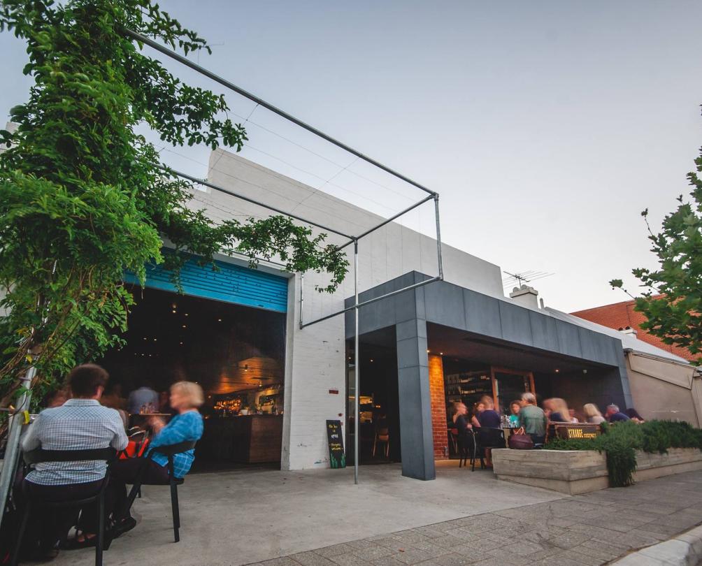 people sitting outside at strange company 