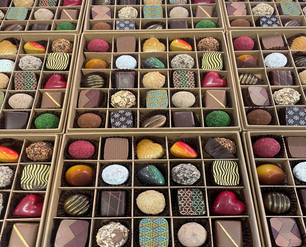 flat lay of lots of different coloured beautiful chocolates
