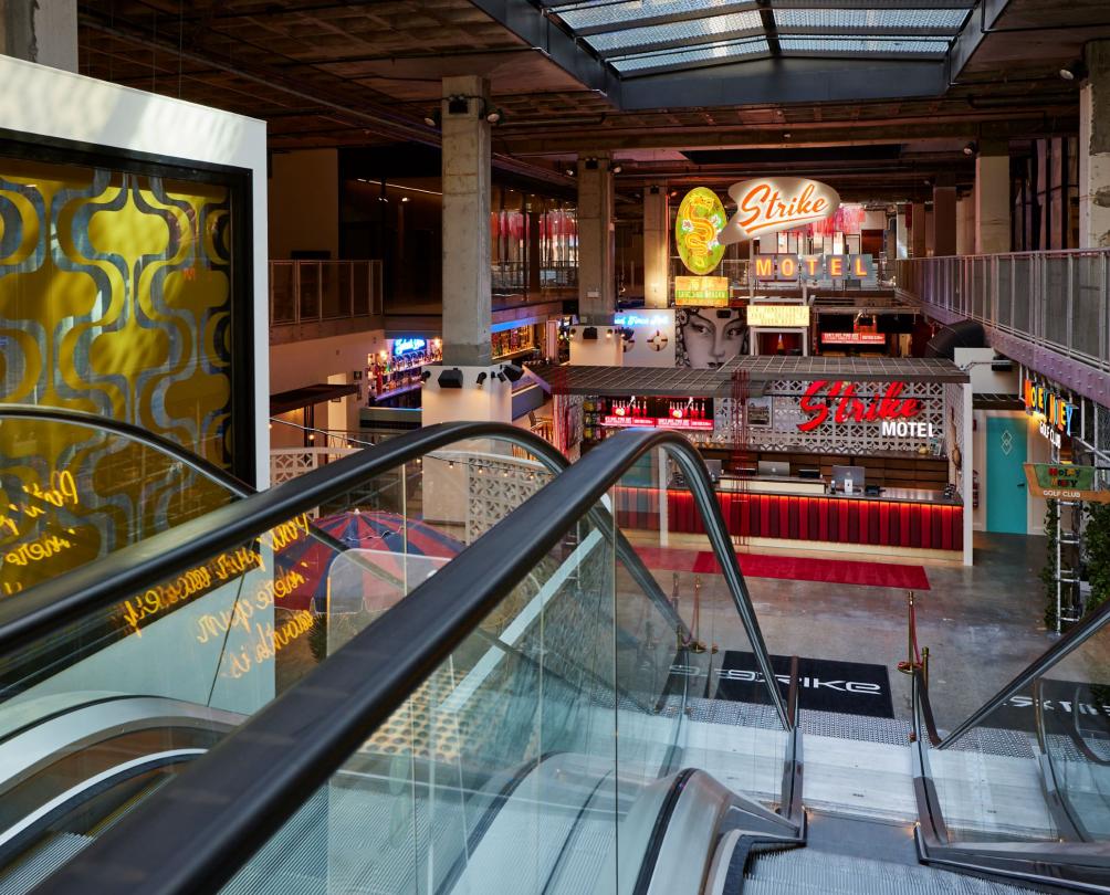 FOMO entrance escalator with neon signage for Funlab at FOMO Fremantle