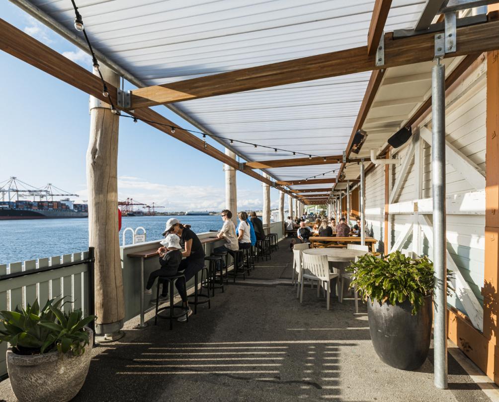 picturesque view of people looking out to ocean from waterfront venue