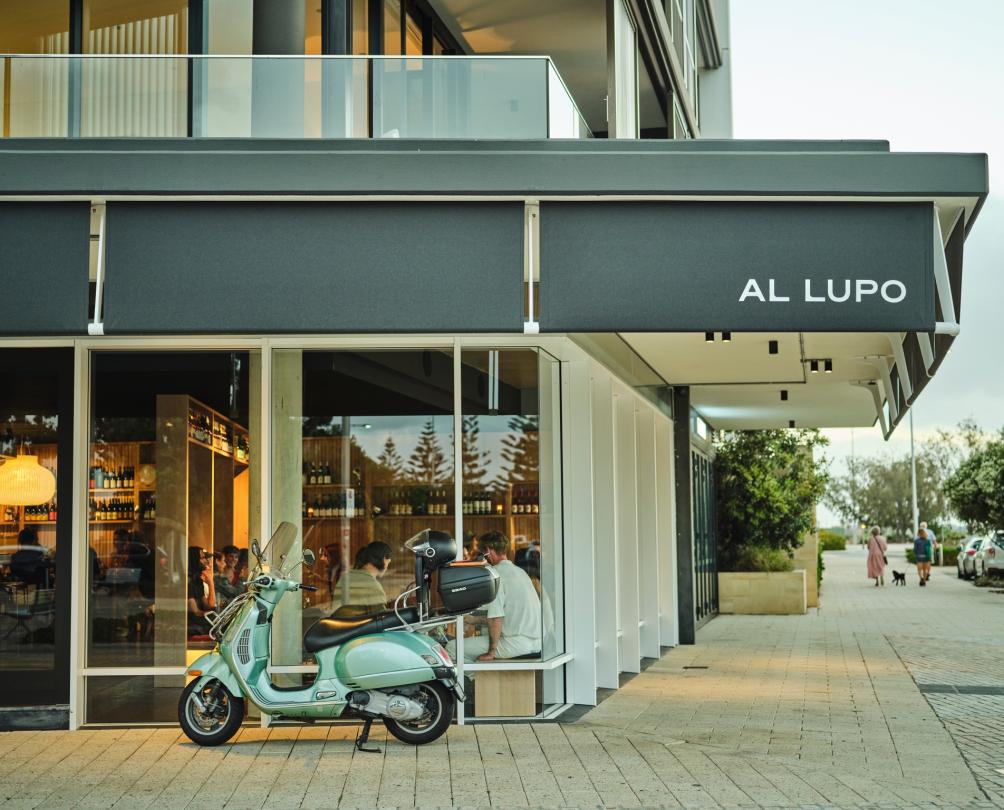 Blue scooter outside Al Lupo restaurant