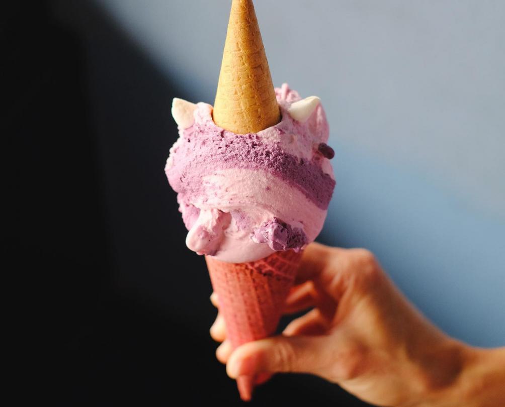 Gelato shaped like a unicorn served in a cone