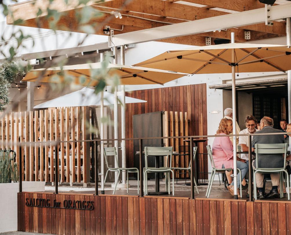 Wooden deck with umbrellas at Sailing for Oranges 