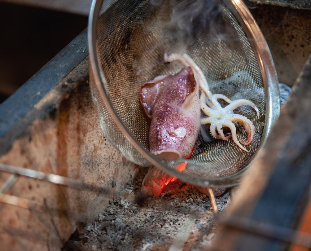 Squid being cooked over charcoal at Sailing for Oranges