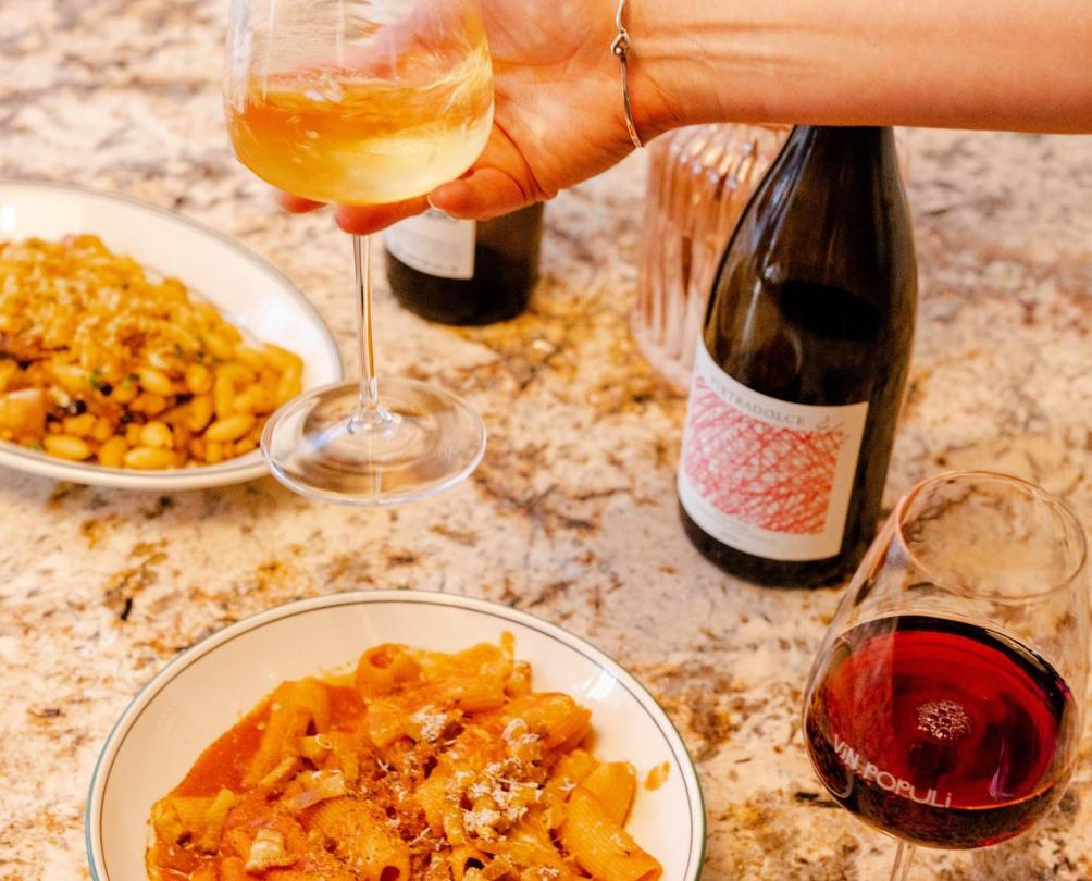 Bowls of pasta on table at Vin Populi 