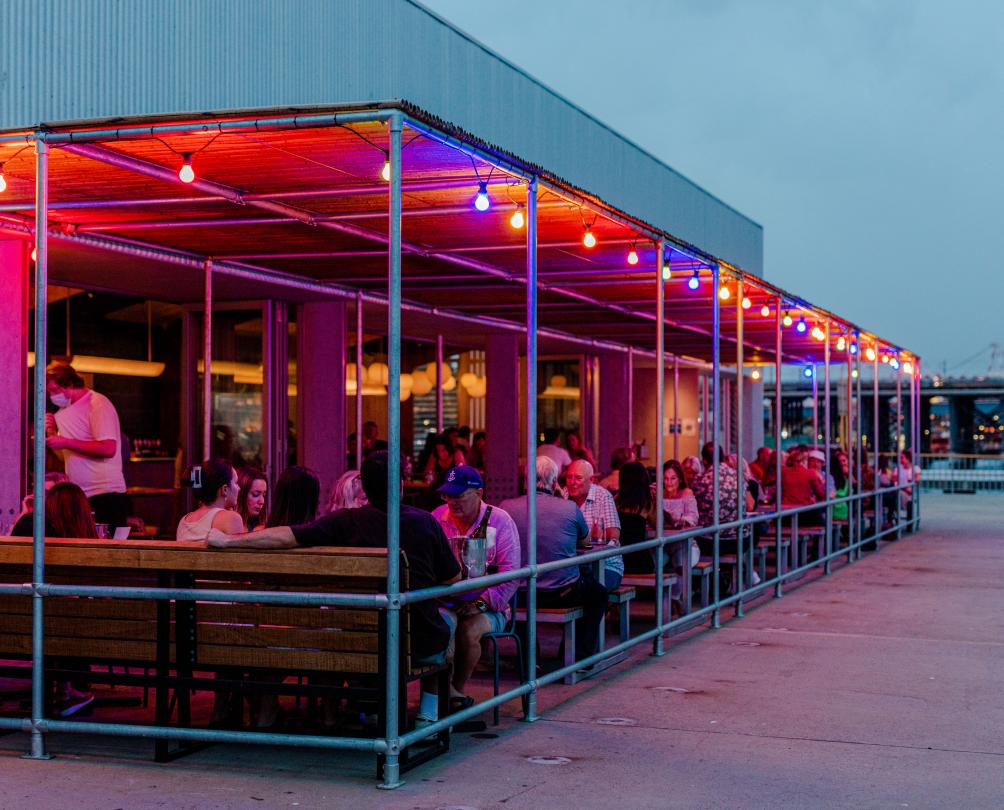 Jetty Bar + Eats at night with coloured lights