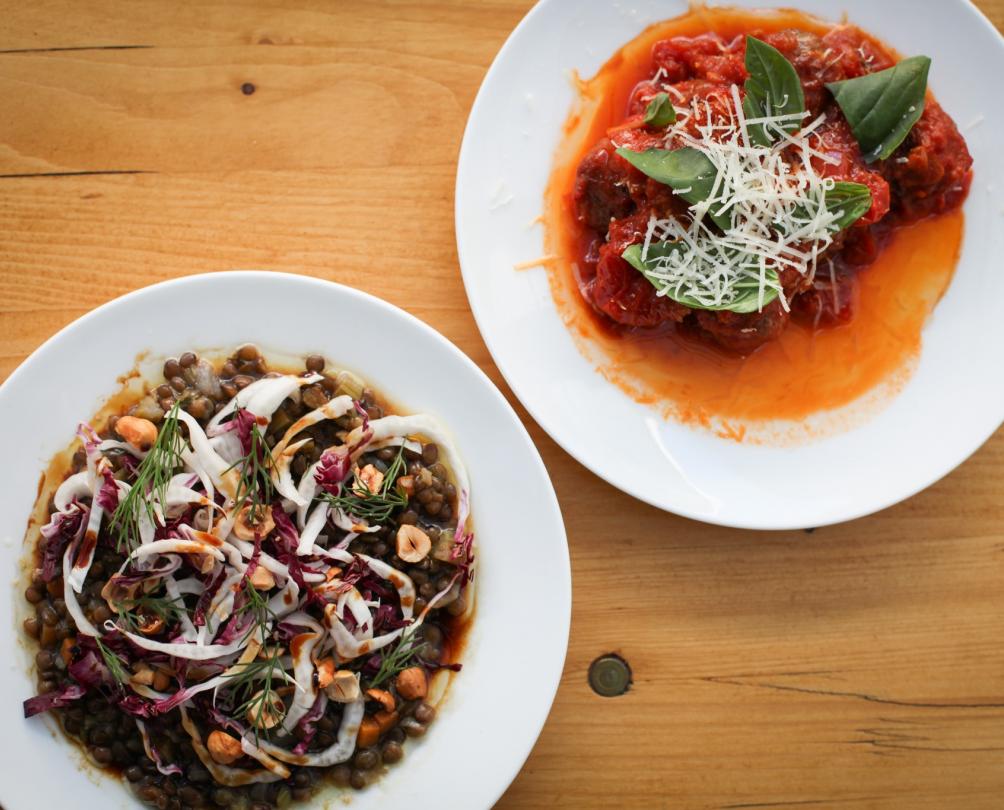 Plates of food on wooden table at Patio Bar Fremantle