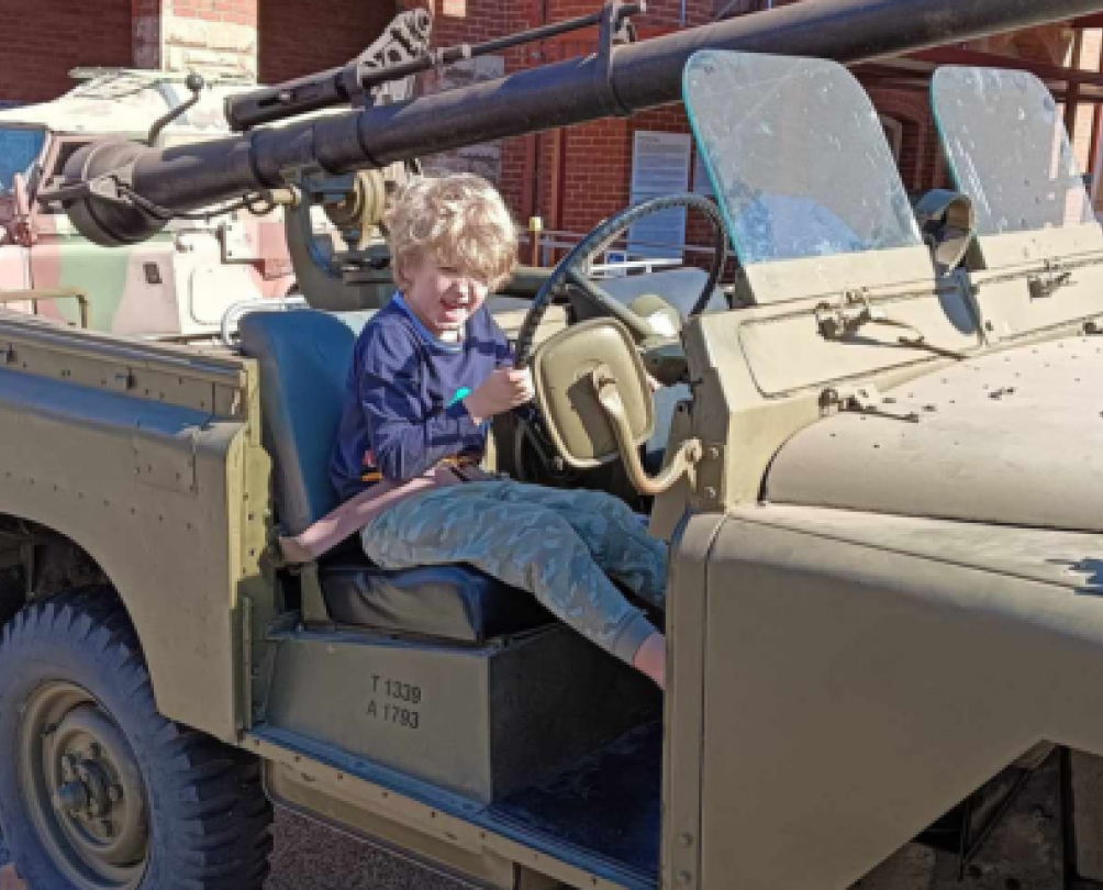 Army Museum of WA - young boy sitting in an old army vehicle 
