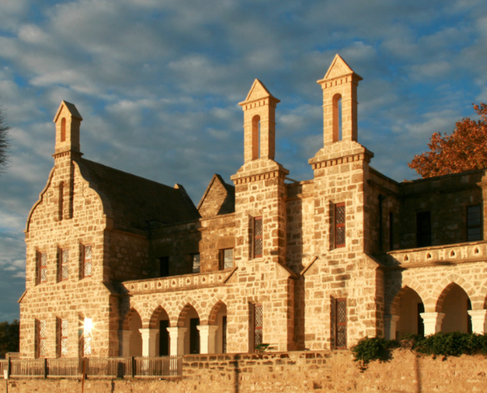 Gothic limestone building is striking against blue sky