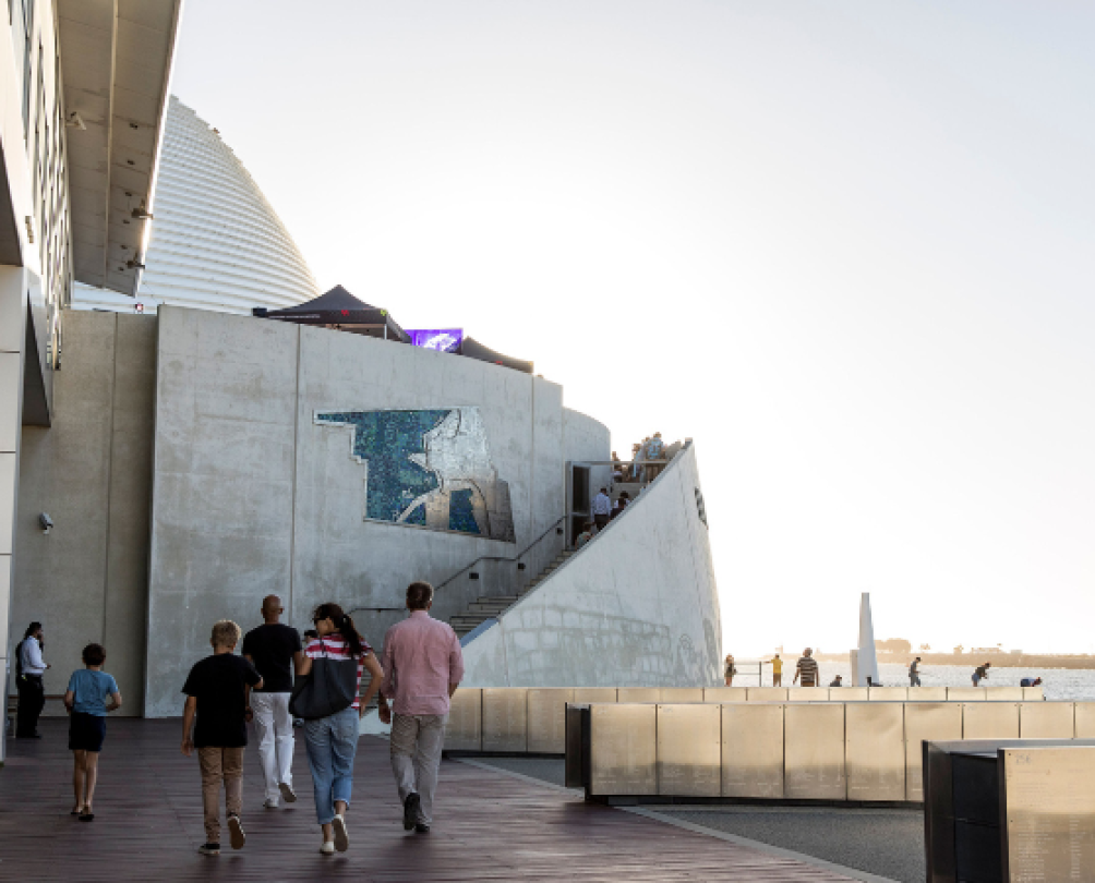 Family walking towards WA Maritime Museum in Fremantle's Waterfront, Victoria Quay