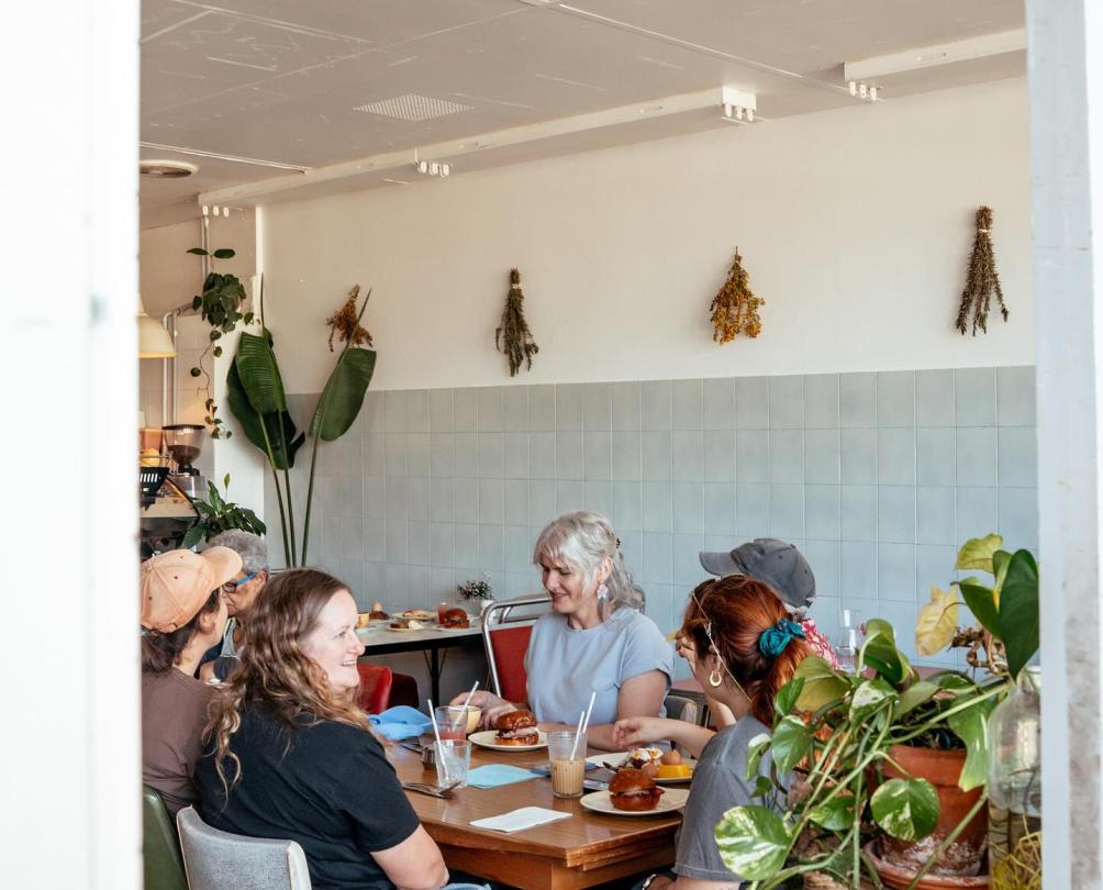 A group of people dining at a cafe together.