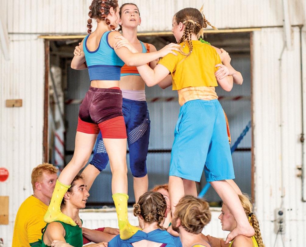 group of kids doing circus tricks