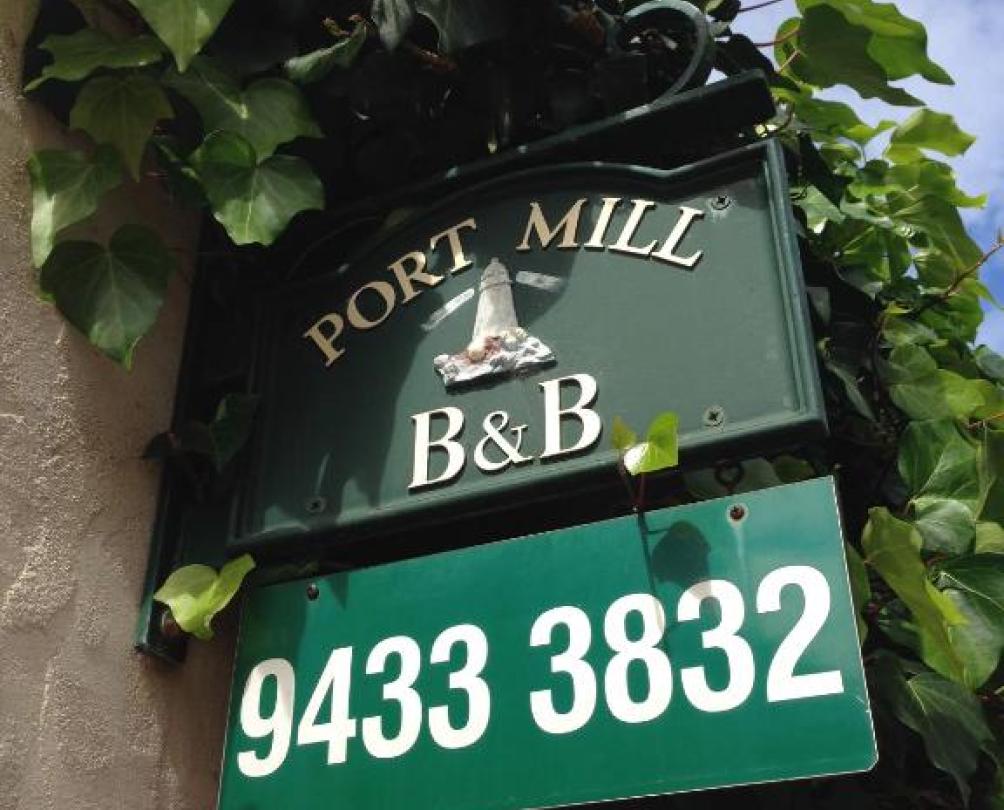 a sign for port mill B&B and the phone number to book 9433 3832