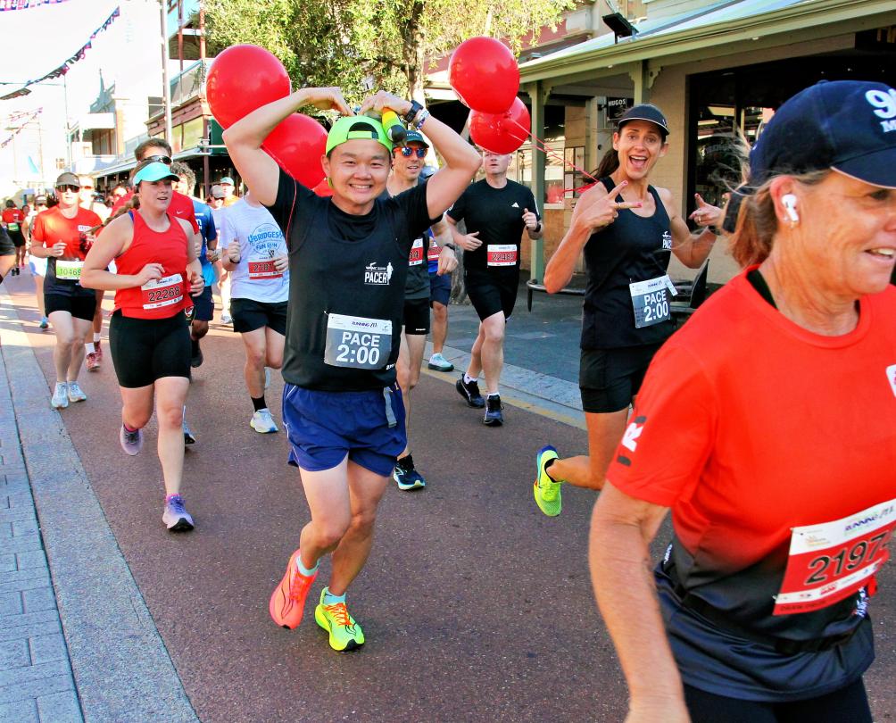 a group of happy runners in the streets of Fremantle 