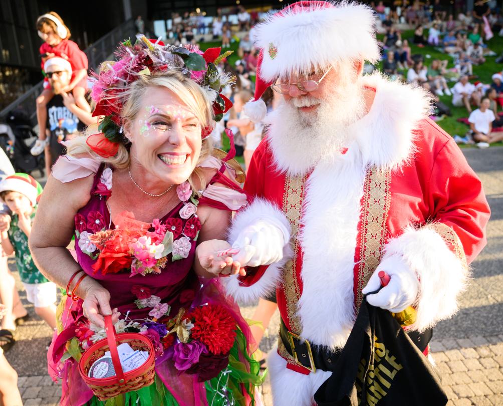 a woman dressed as a fairy next to Santa in Fremantle at Walyalup Koort