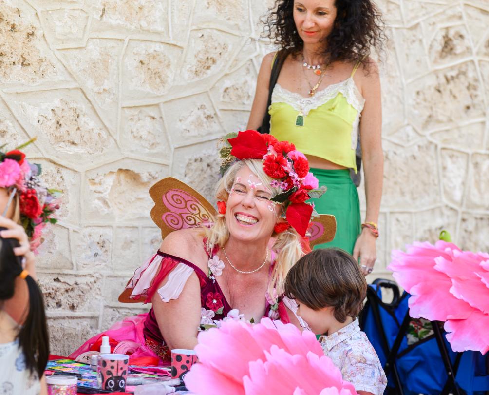 Fairy Sandie at an event doing face painting