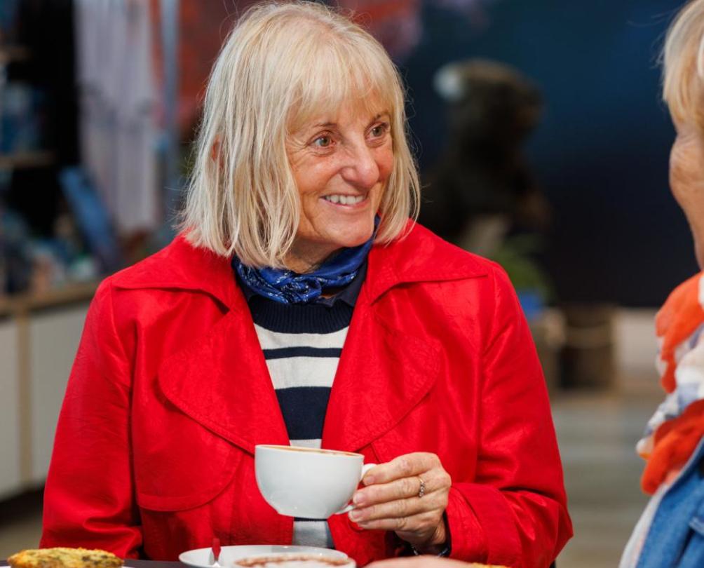 a woman having a coffee with friends at the WA Maritime Museum 