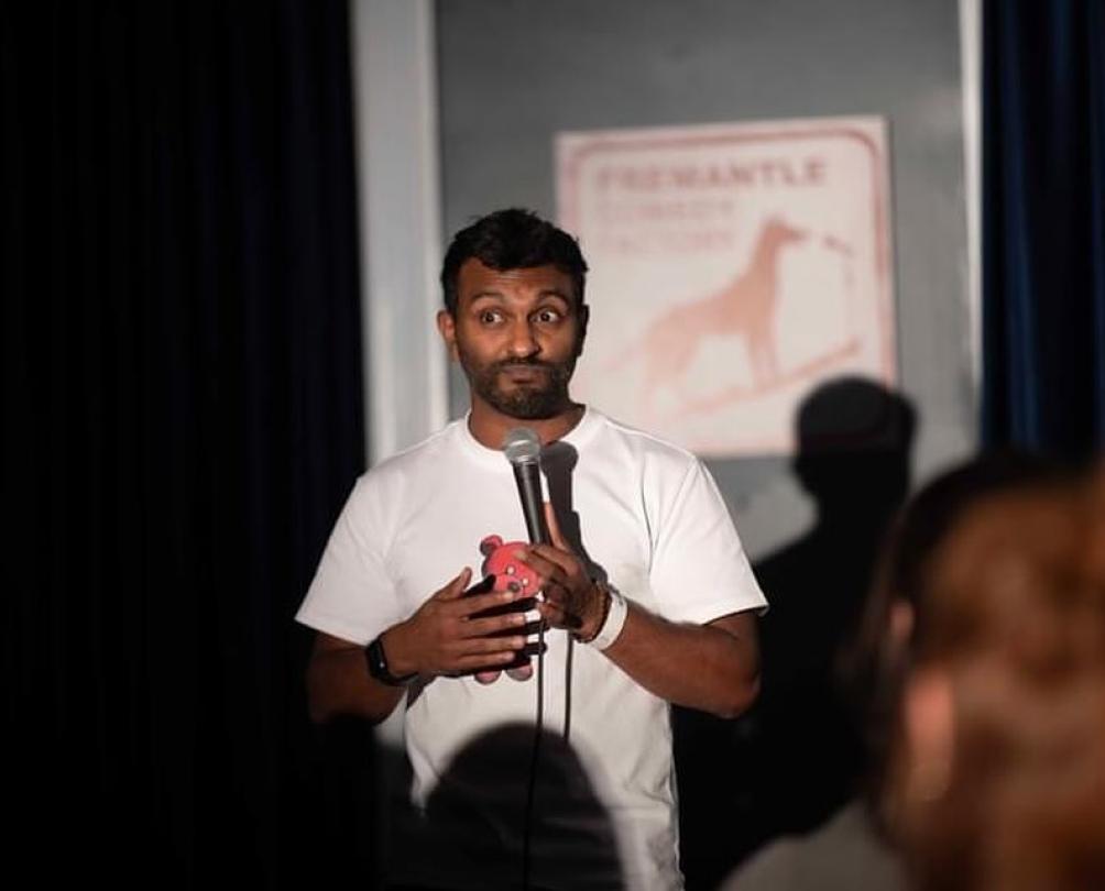 a man on a stage with a microphone