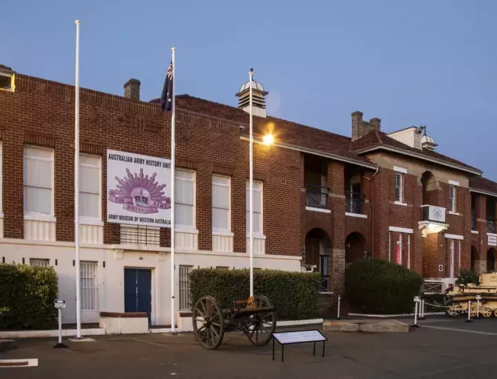 exterior shot of the army museum at dusk with some lights lit