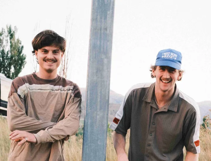 two young guys in a field 