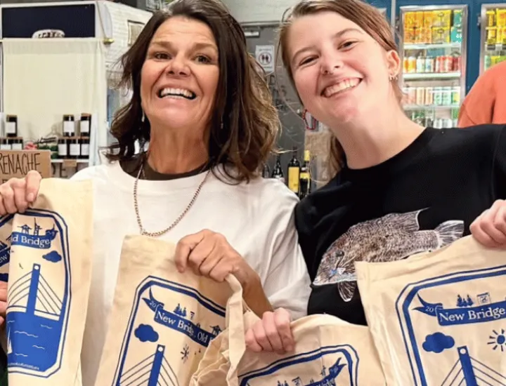 women holding up free tote bags at Old Bridge Fremantle 